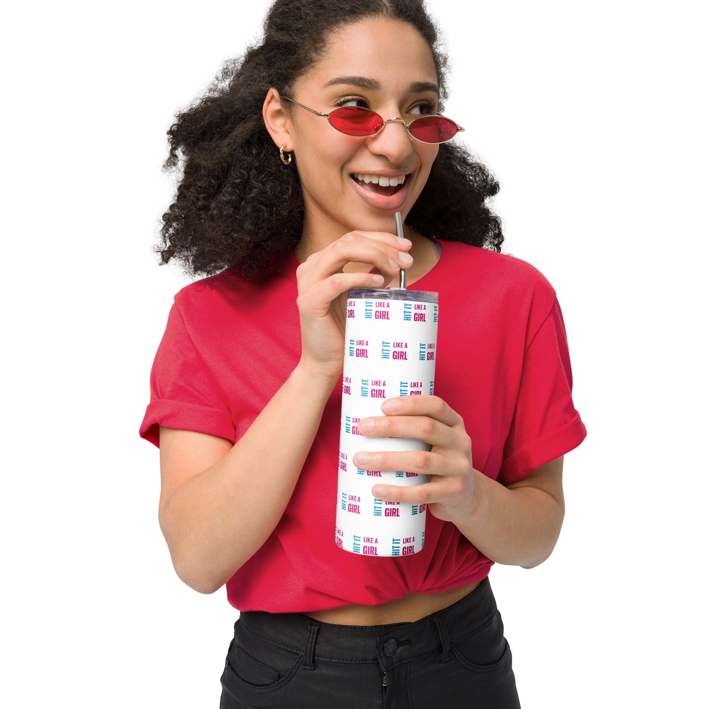 Stylish woman holding white Hit It Like a Girl tumbler covered in repeating pink and blue logo — sleek, motivational drinkware for fierce women.