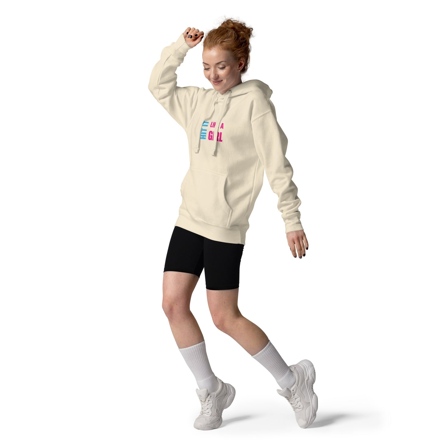 Confident woman rocking Hit It Like a Girl hoodie and sporty style — empowering female sportswear for everyday athletes.