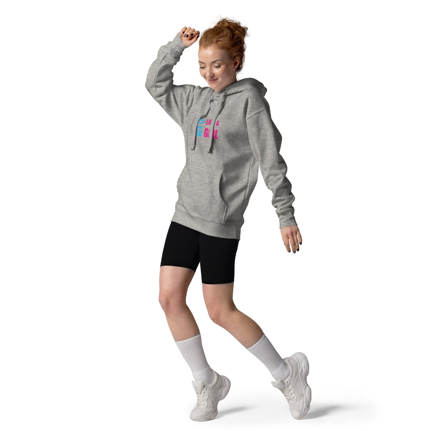 Empowered woman dancing in branded hoodie — “Hit It Like a Girl” fashion for confident movers, players, and doers.