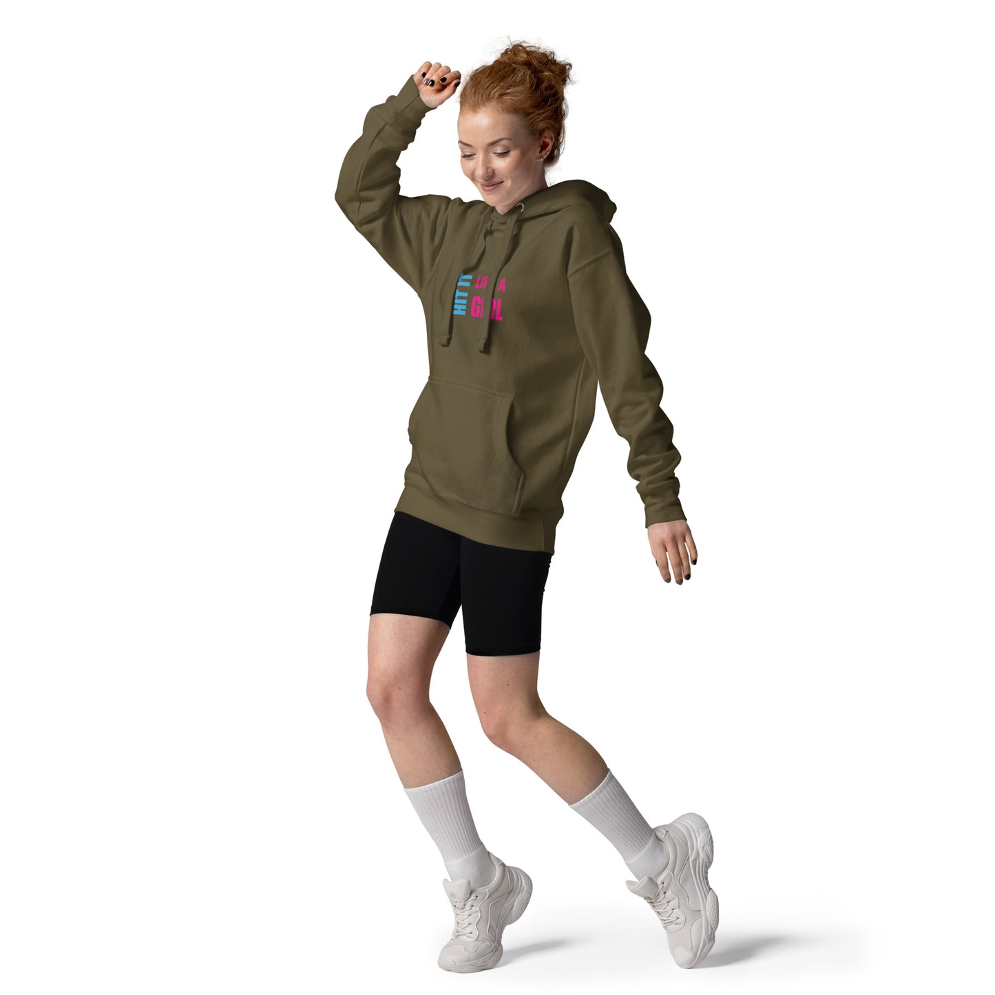 Confident woman rocking Hit It Like a Girl hoodie and sporty style — empowering female sportswear for everyday athletes.