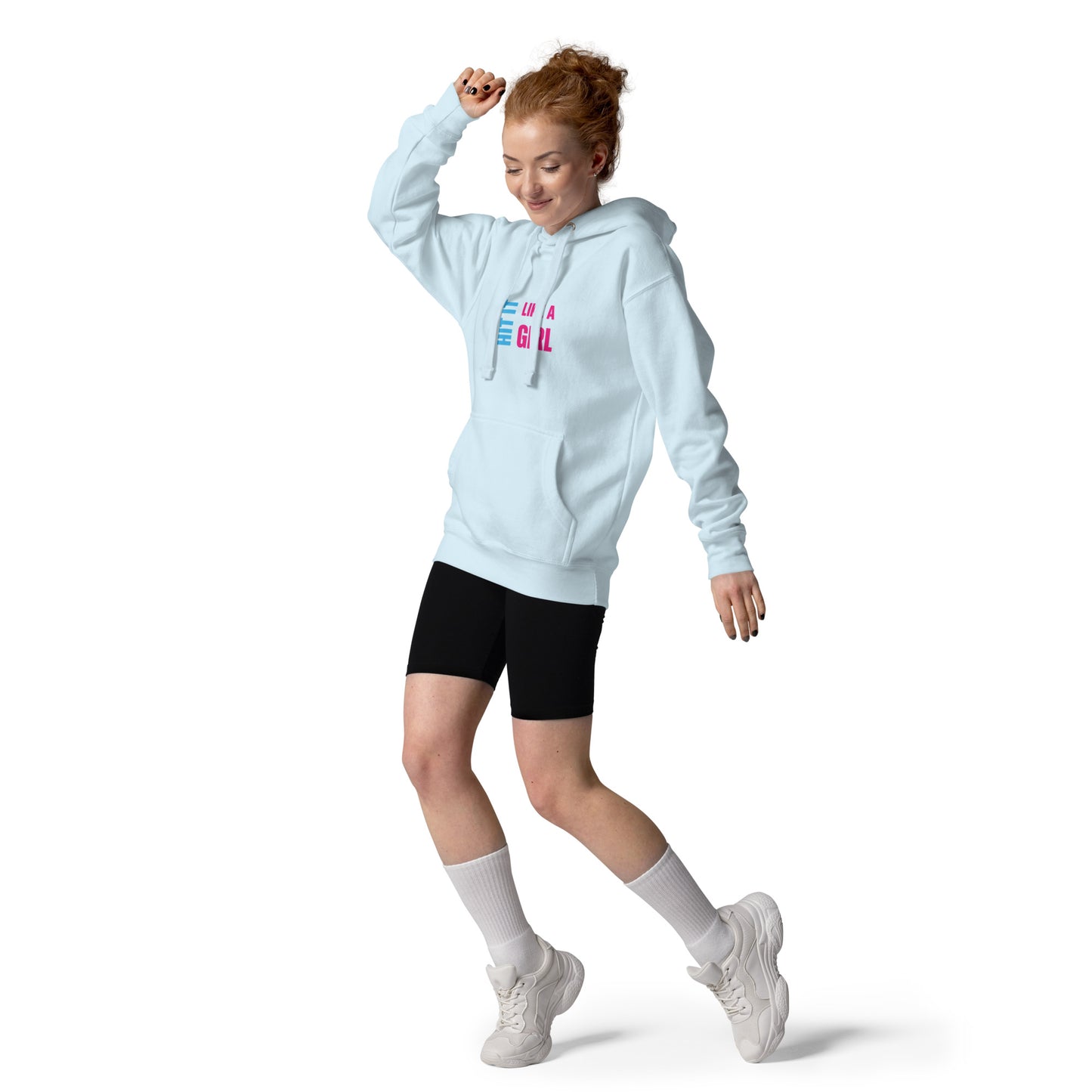 Empowering casual wear for athletes — woman wearing “Hit It Like a Girl” hoodie with black shorts and tennis socks.