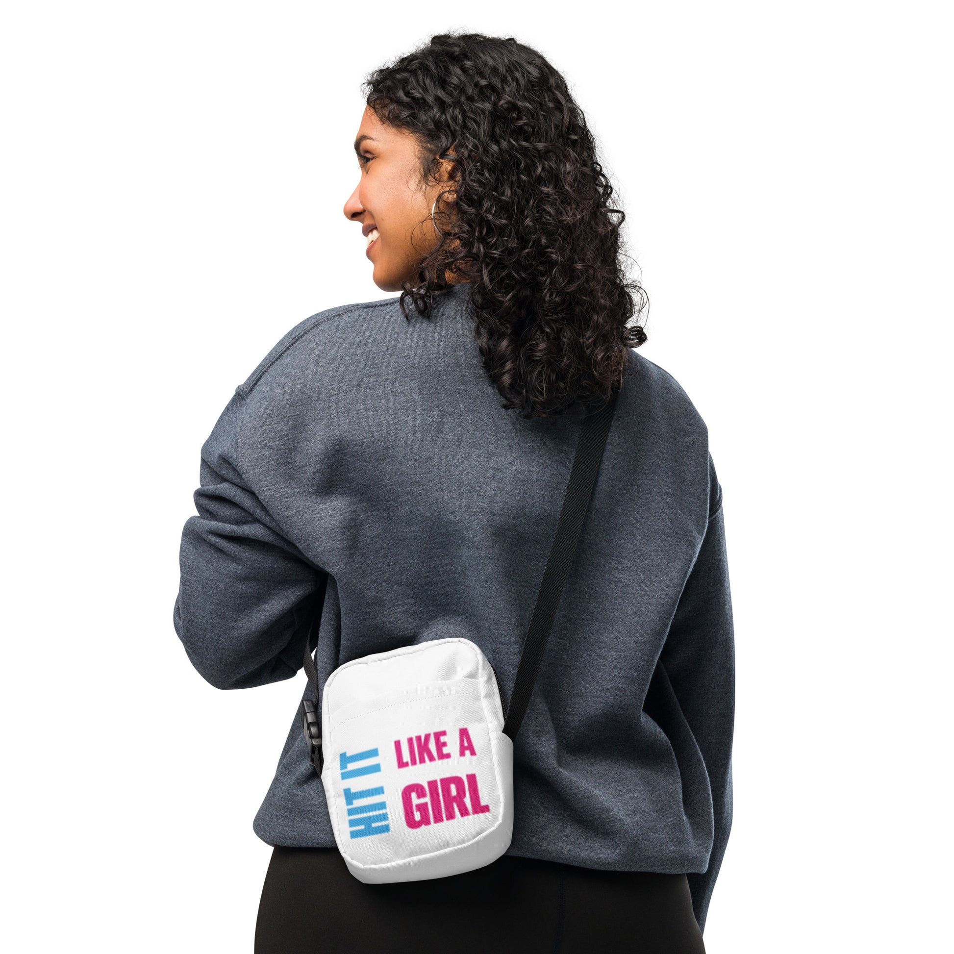 Back view of woman in sweatshirt with white Hit It Like a Girl mini bag — stylish and functional streetwear for active lifestyles.