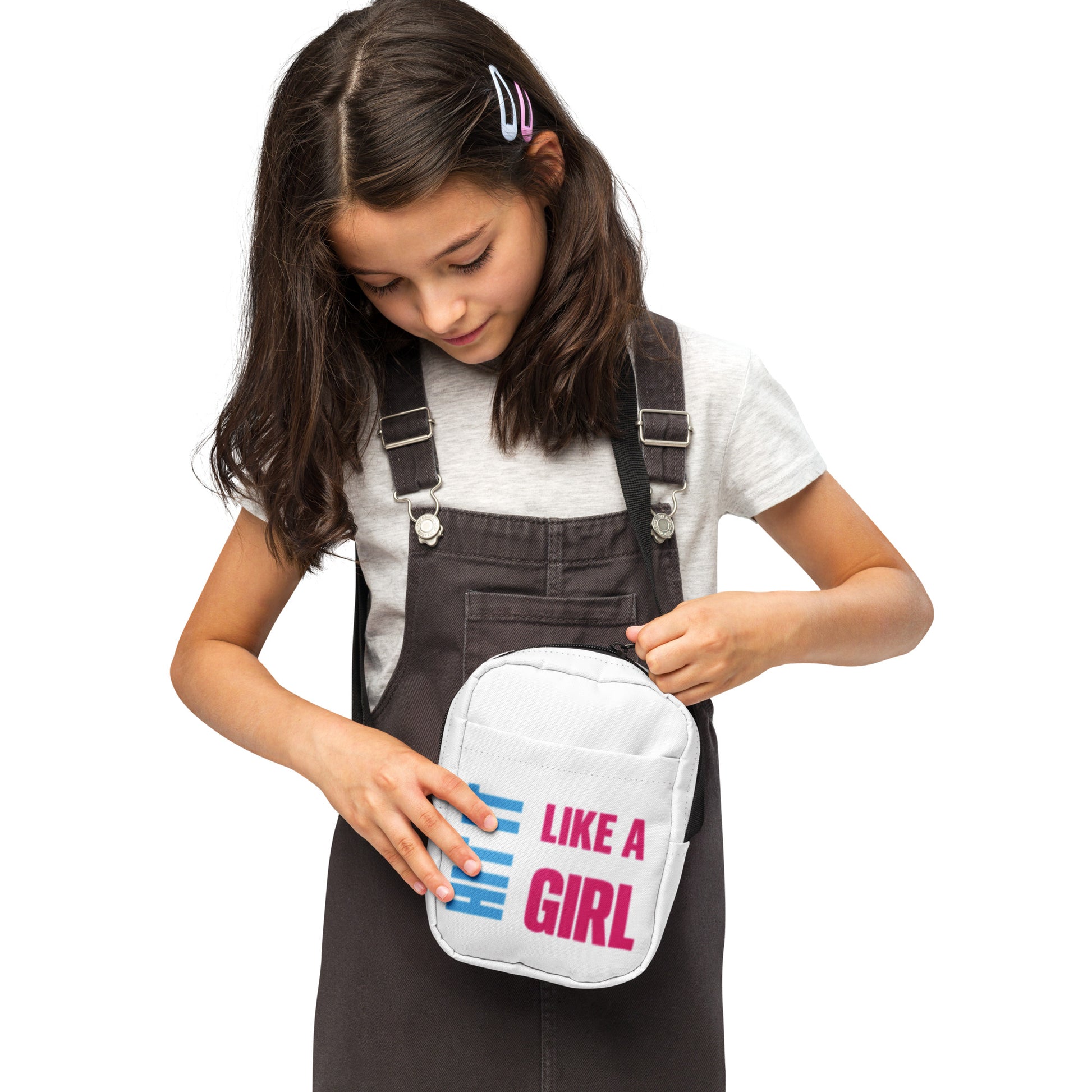 Hit It Like a Girl shoulder bag in white with black strap and logo — bold everyday accessory for confident athletes and changemakers.