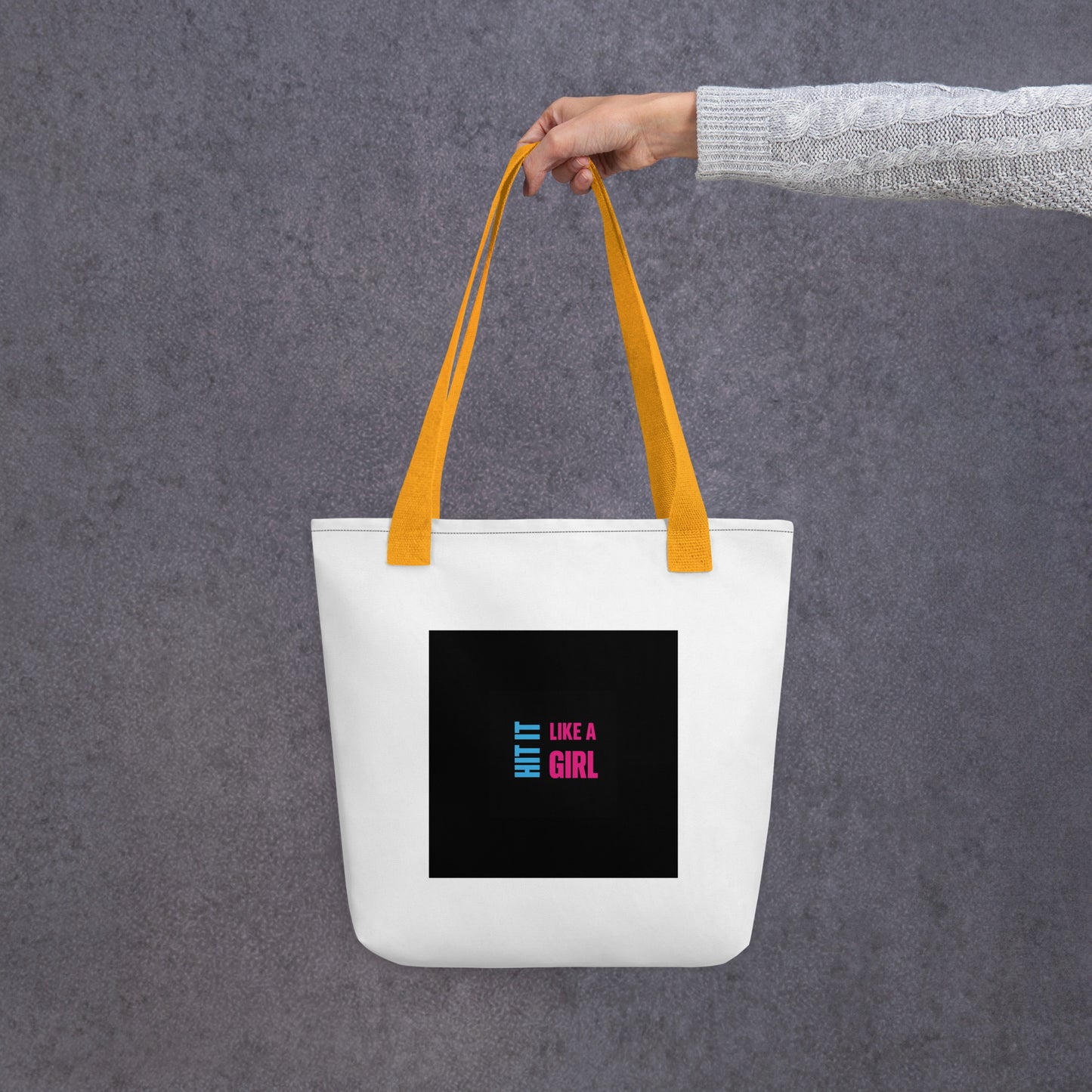Statement tote bag with black handles and Hit It Like a Girl logo — practical and powerful carry-all for daily use.