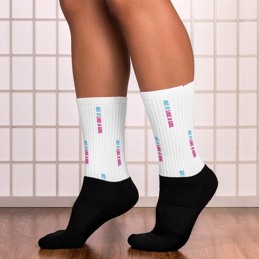 Women’s sports socks with bold Hit It Like a Girl text — black compression-style crew socks for fierce play and recovery.