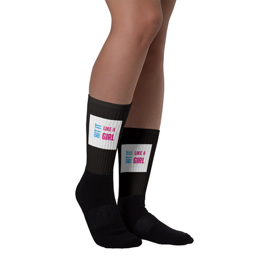 Empowering black crew socks with Hit It Like a Girl branding — stylish and durable gear for sports and everyday wear.