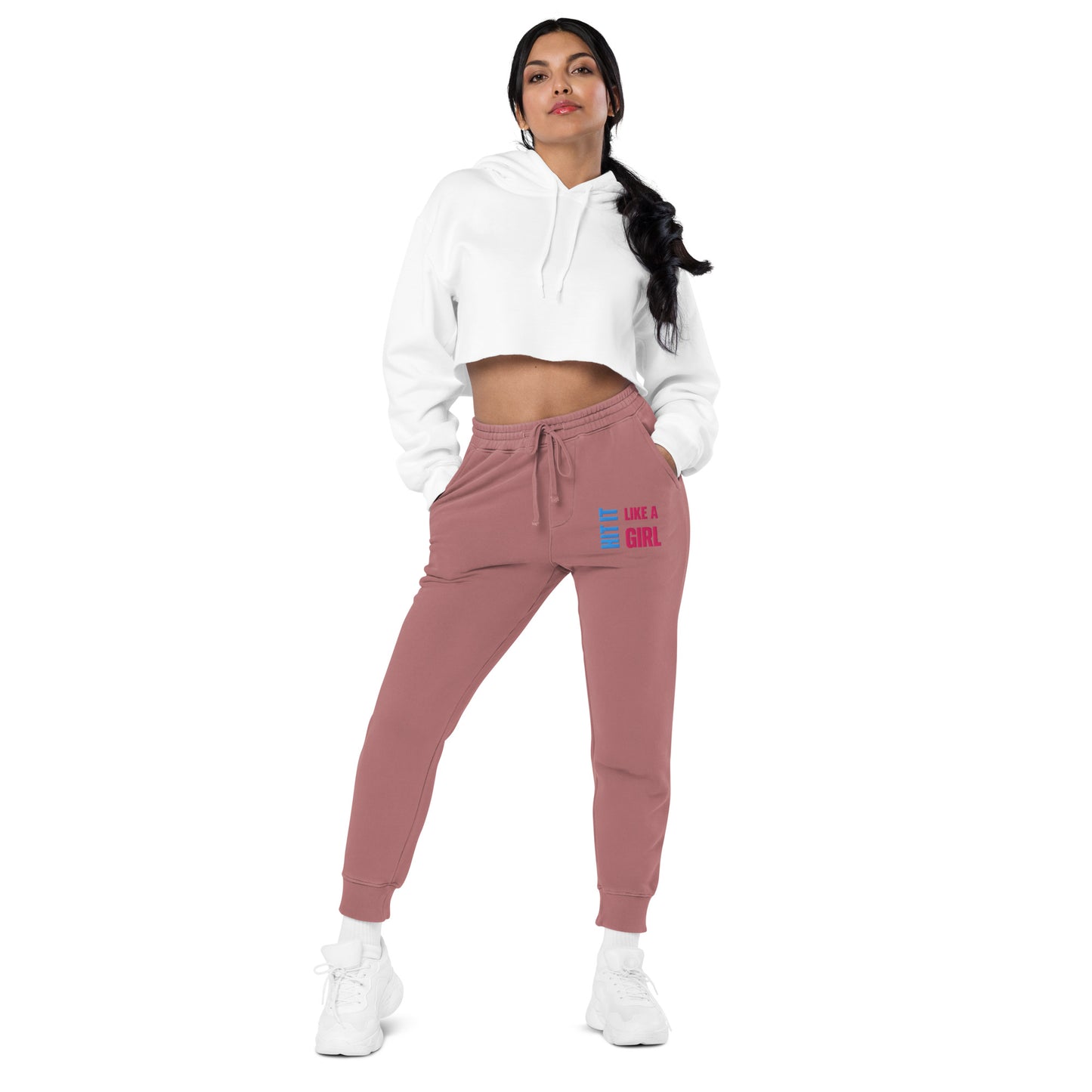 Woman posing in maroon joggers designed for confident, active women athletes