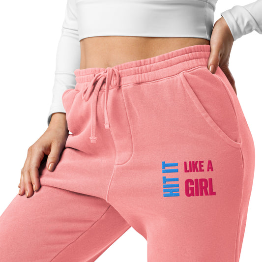 Women's pink joggers featuring Hit It Like a Girl branding — soft, stylish sweatpants designed for strength and comfort.