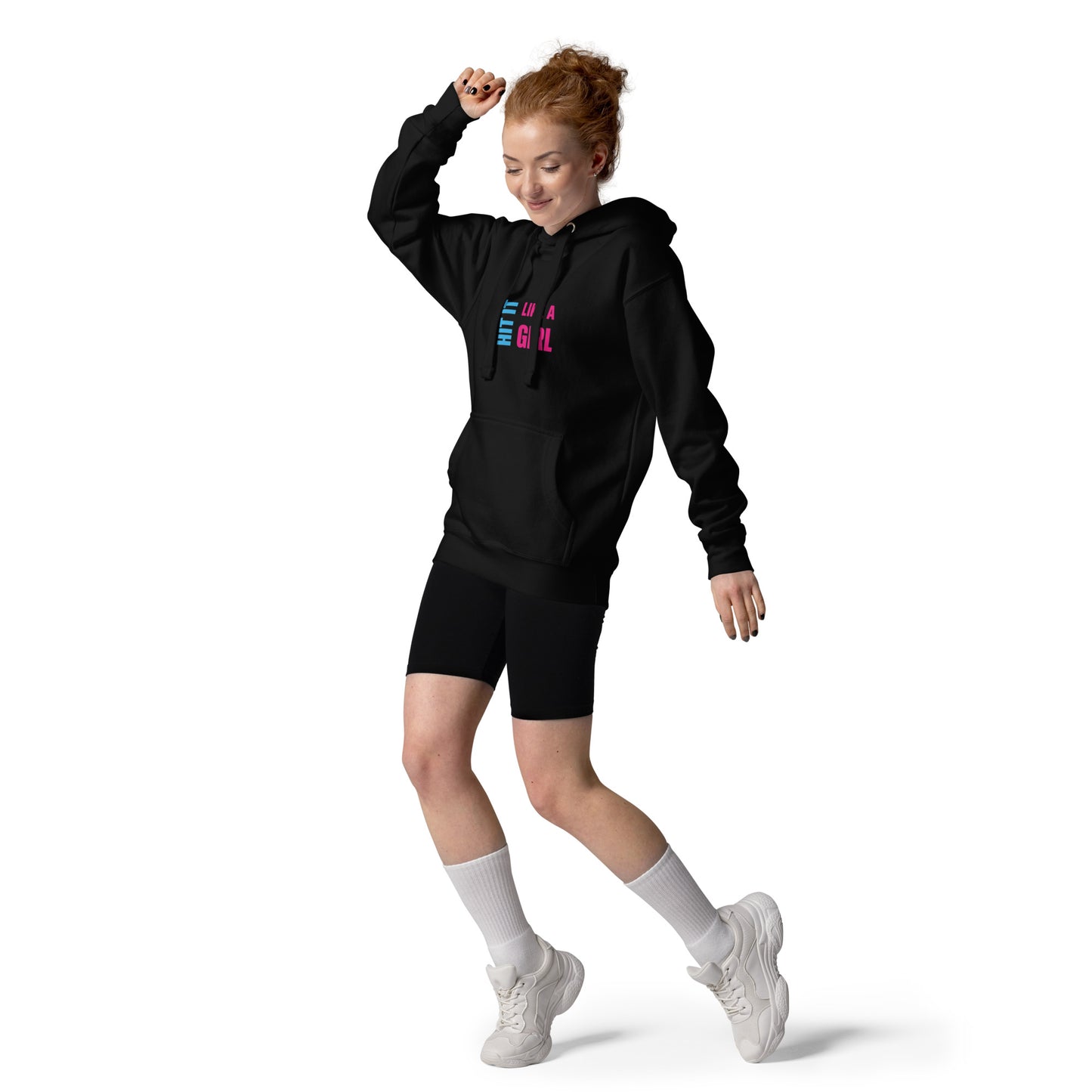 Confident woman rocking Hit It Like a Girl hoodie and sporty style — empowering female sportswear for everyday athletes.