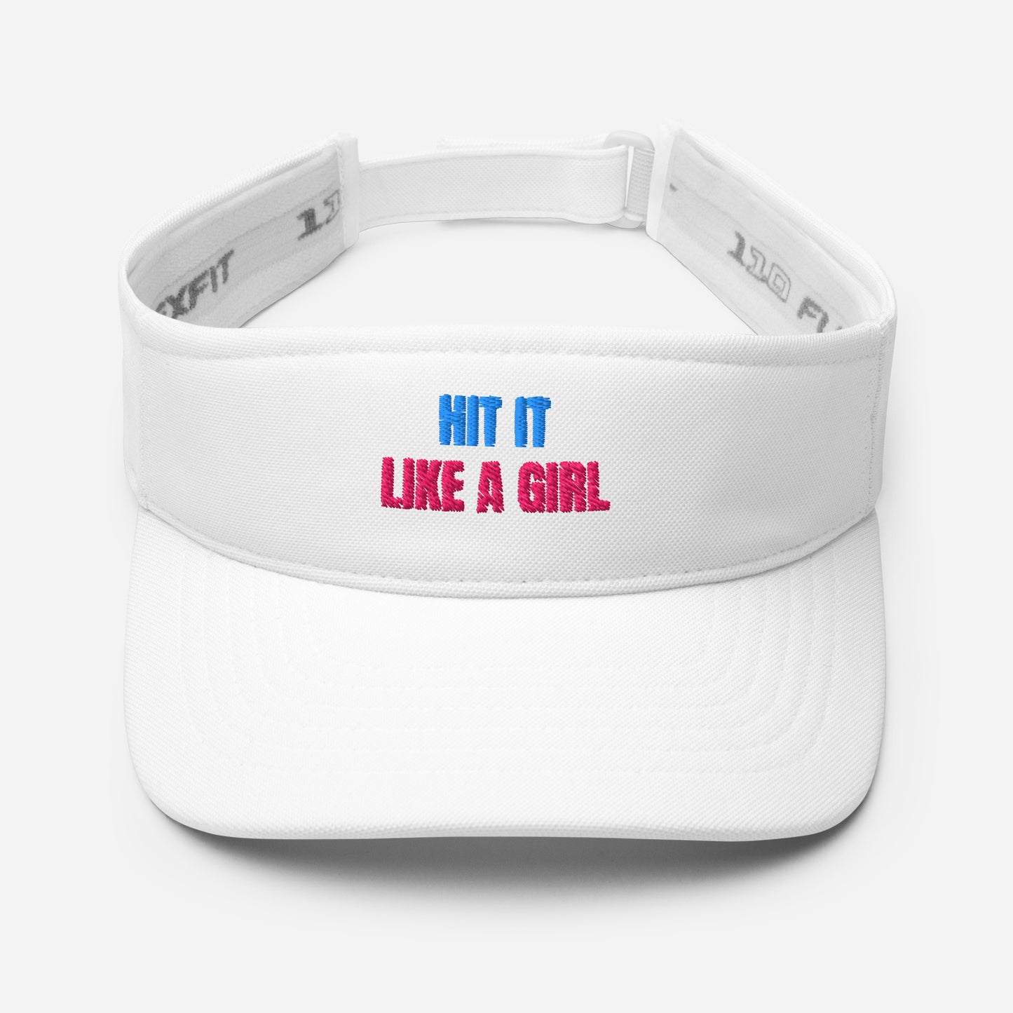 White athletic visor with "Hit It Like a Girl" logo in pink and blue embroidery, designed for female athletes in tennis, golf, pickleball, and more.